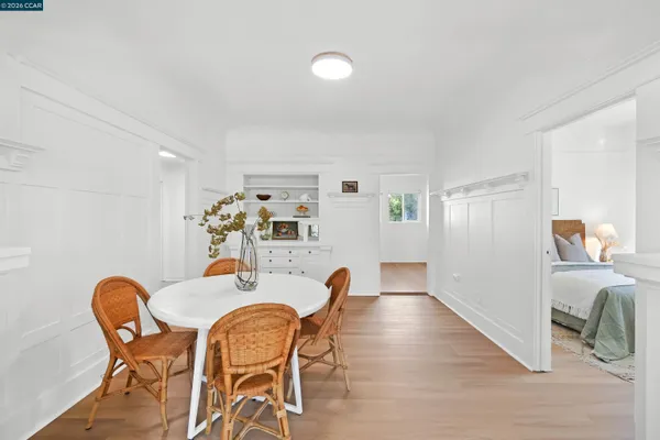 a view of a dining room with furniture and wooden floor