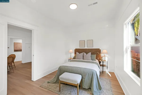 a view of a bathroom with wooden floor and a bathroom view