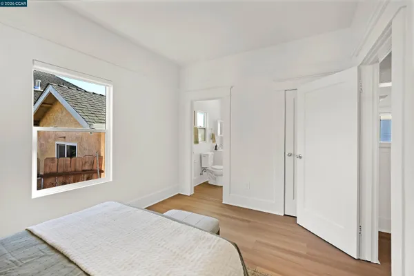 a bedroom with a bed and lamp