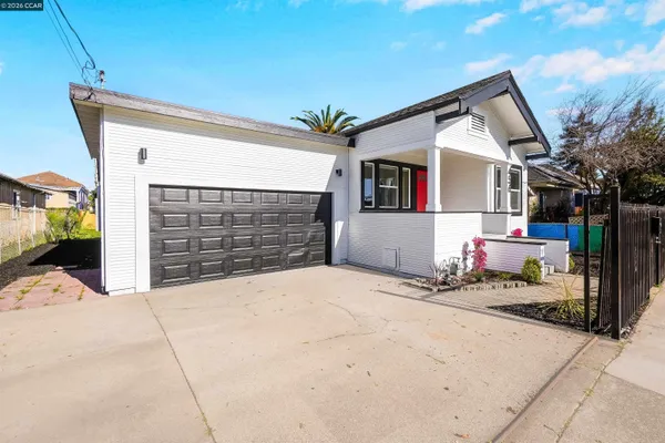 a front view of a house with a garage
