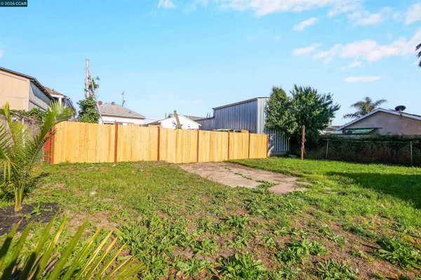 a view of a backyard with a garden and plants