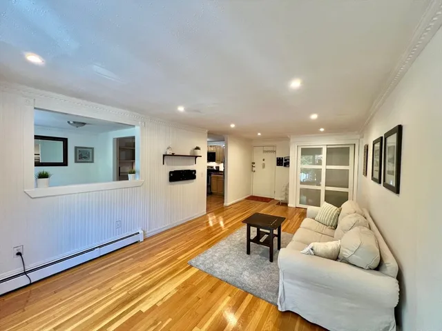 a living room with furniture and a table