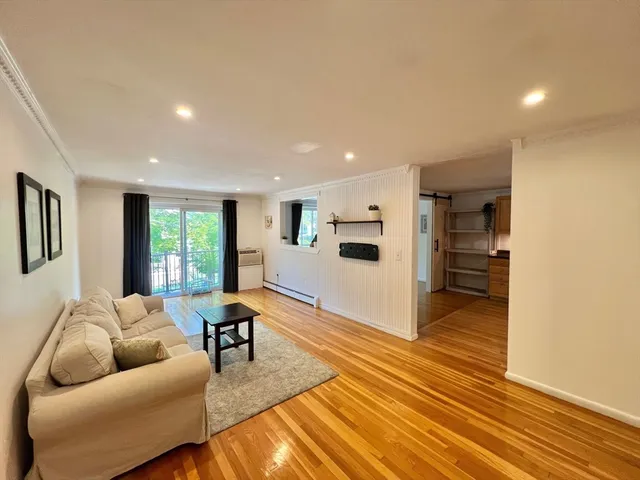 a living room with furniture and a table