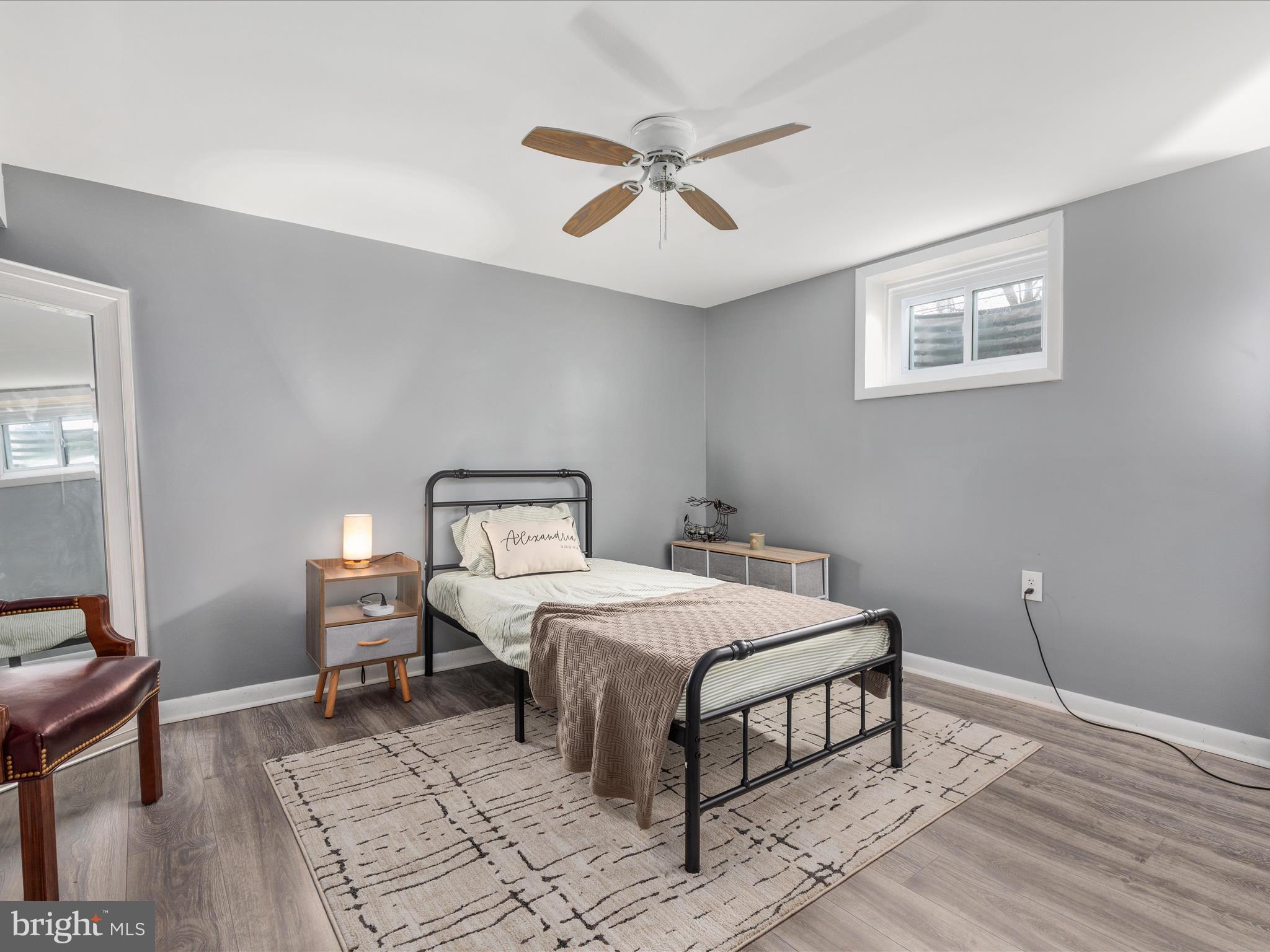 4002 Ronson Drive Alexandria, VA 22310 - Photo 22 of 30 a bedroom with a bed and wooden floor