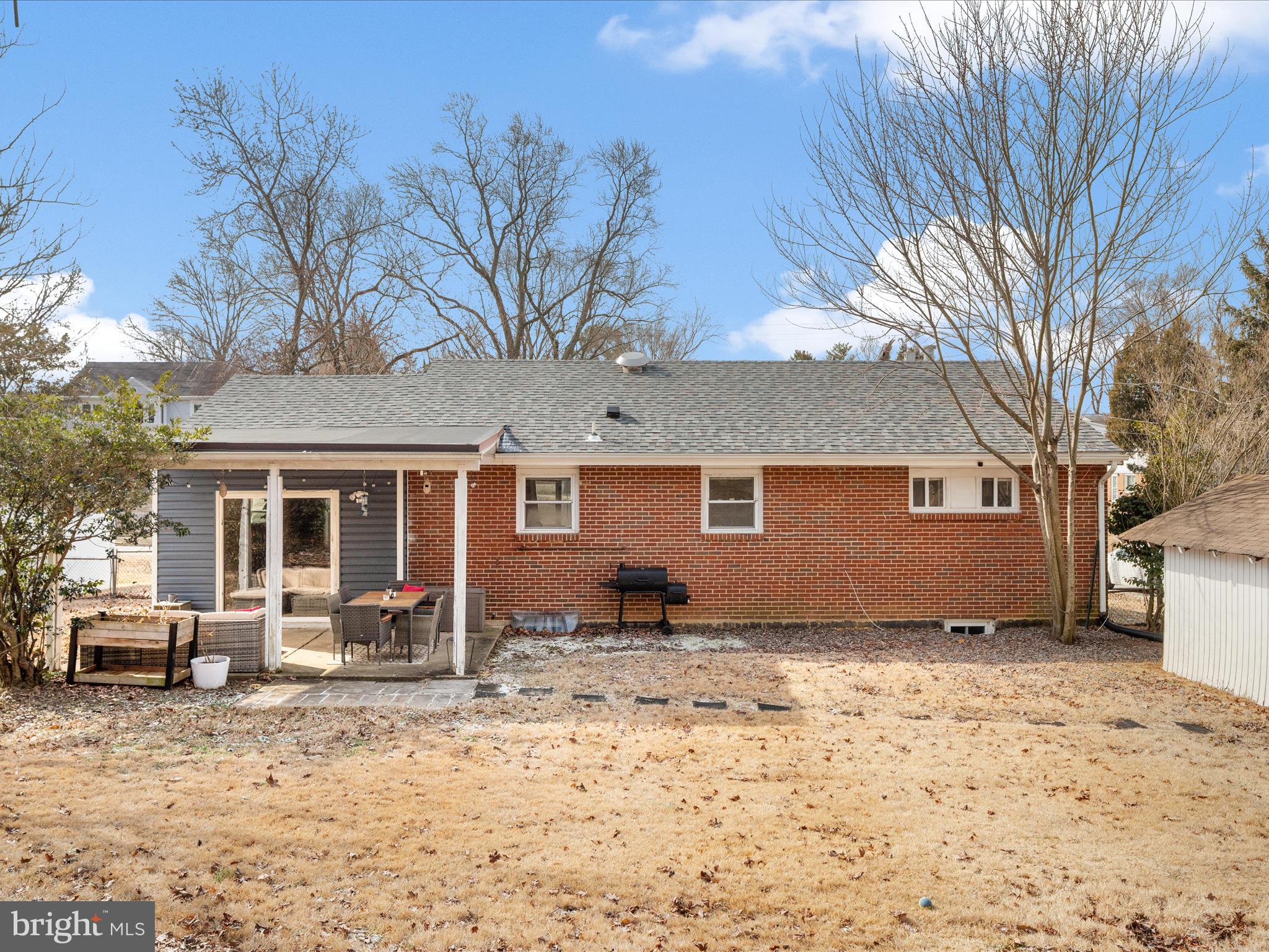 4002 Ronson Drive Alexandria, VA 22310 - Photo 27 of 30 a view of a house with a yard covered in snow