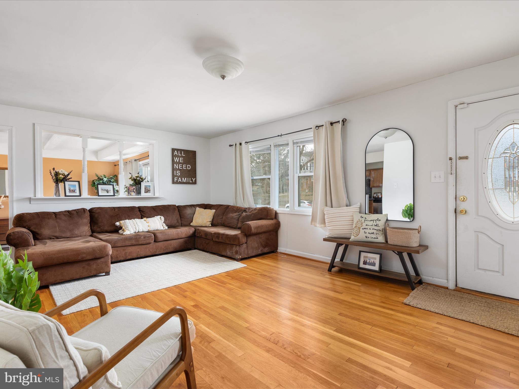4002 Ronson Drive Alexandria, VA 22310 - Photo 4 of 30 a living room with furniture a wooden floor and a large window
