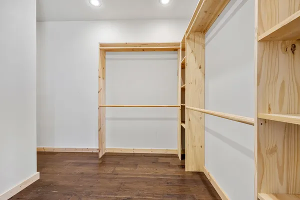 a view of an empty walk in closet