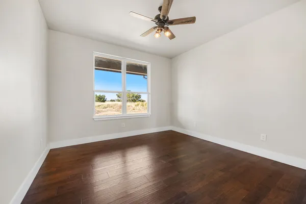 a bathroom with a granite countertop sink and a mirror a bathtub