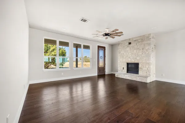 a kitchen with stainless steel appliances granite countertop a sink and a stove