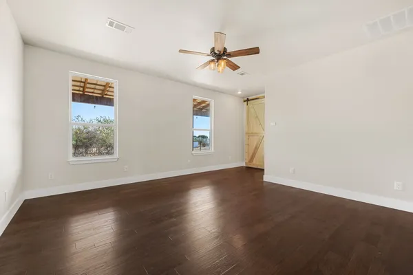a bathroom with a double vanity sink mirror and shower
