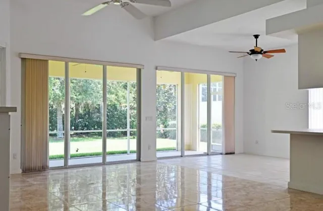 a view of an empty room with a window