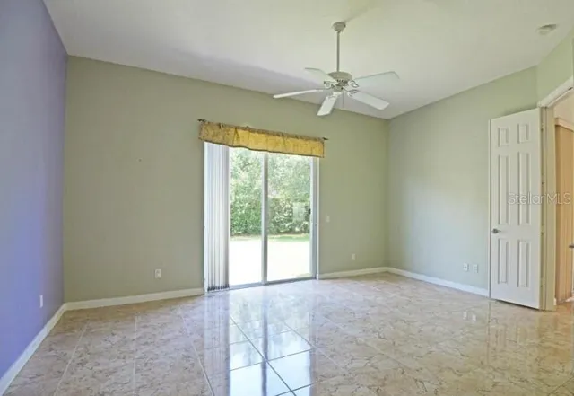 a view of a kitchen with a sink and cabinets