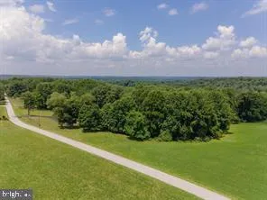 a view of a garden with a building in the background