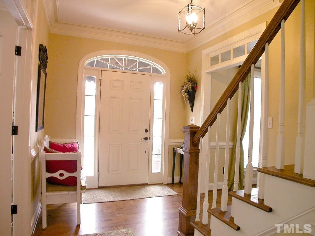4000 Heathgate Lane Raleigh, NC 27613 - Photo 3 of 19 Smooth ceilings, Transom windows, crown & chair moulding; beautiful hardwood floors throughout main level and front stairs Foyer