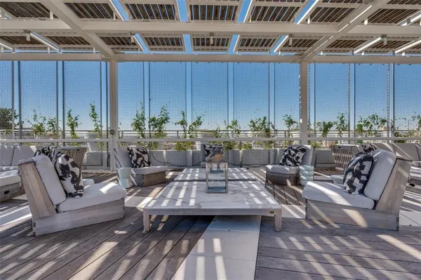 a view of swimming pool with outdoor seating