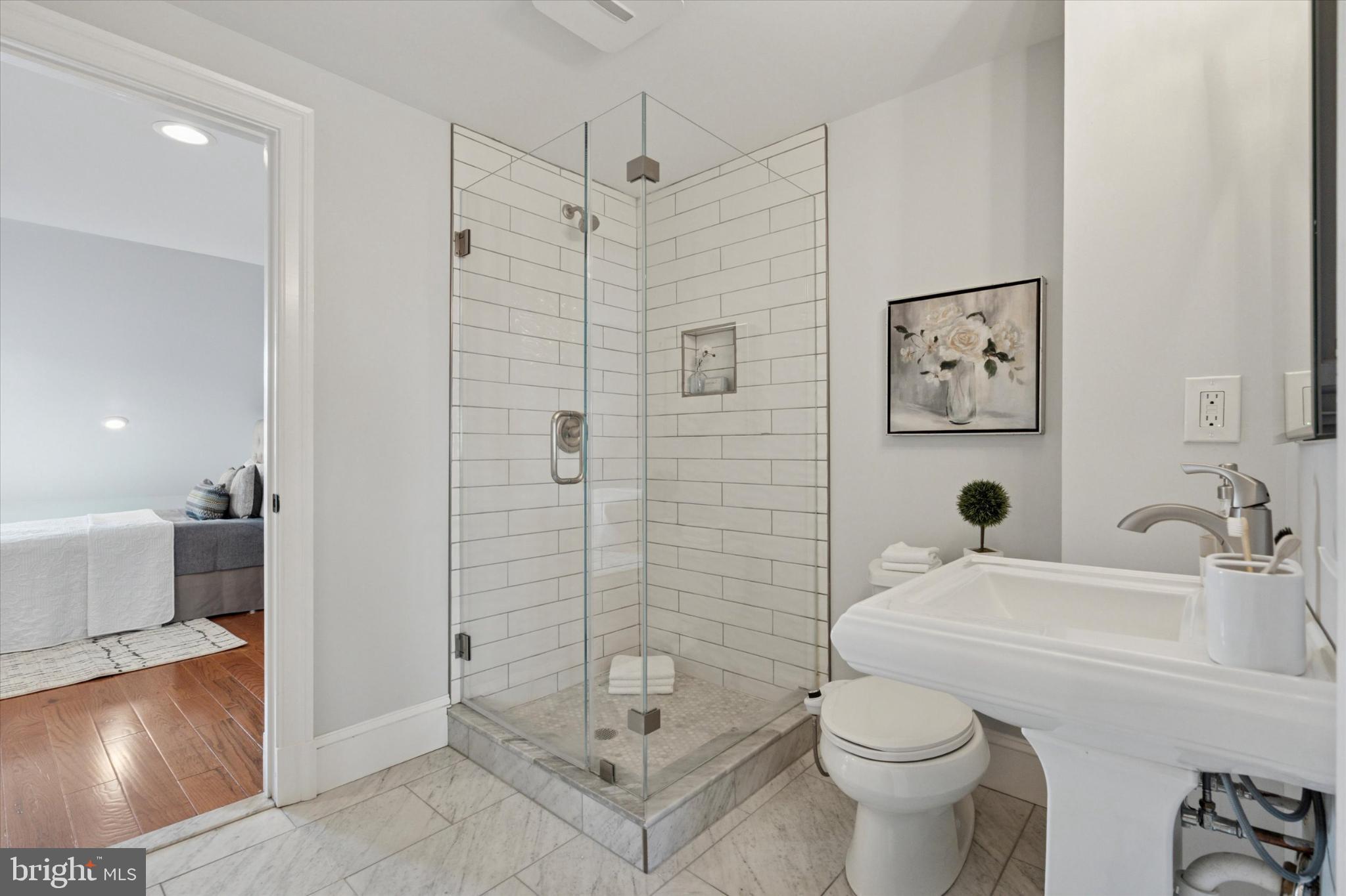 1215 Spruce Street, Unit 301 Philadelphia, PA 19107 - Photo 22 of 27 a bathroom with a sink toilet and shower