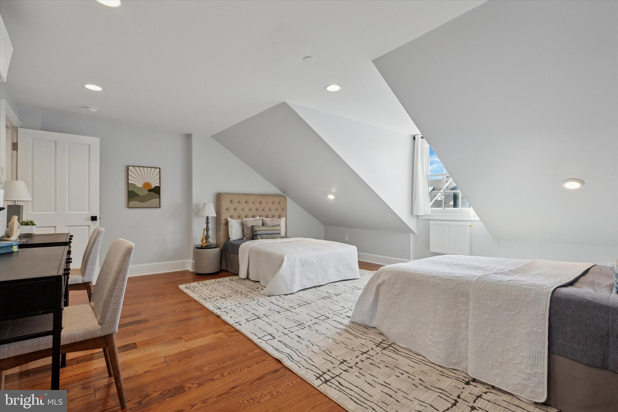 1215 Spruce Street, Unit 301 Philadelphia, PA 19107 - Photo 24 of 27 a bedroom with two beds and a chair