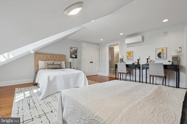 a bedroom with double bed and a large mirror