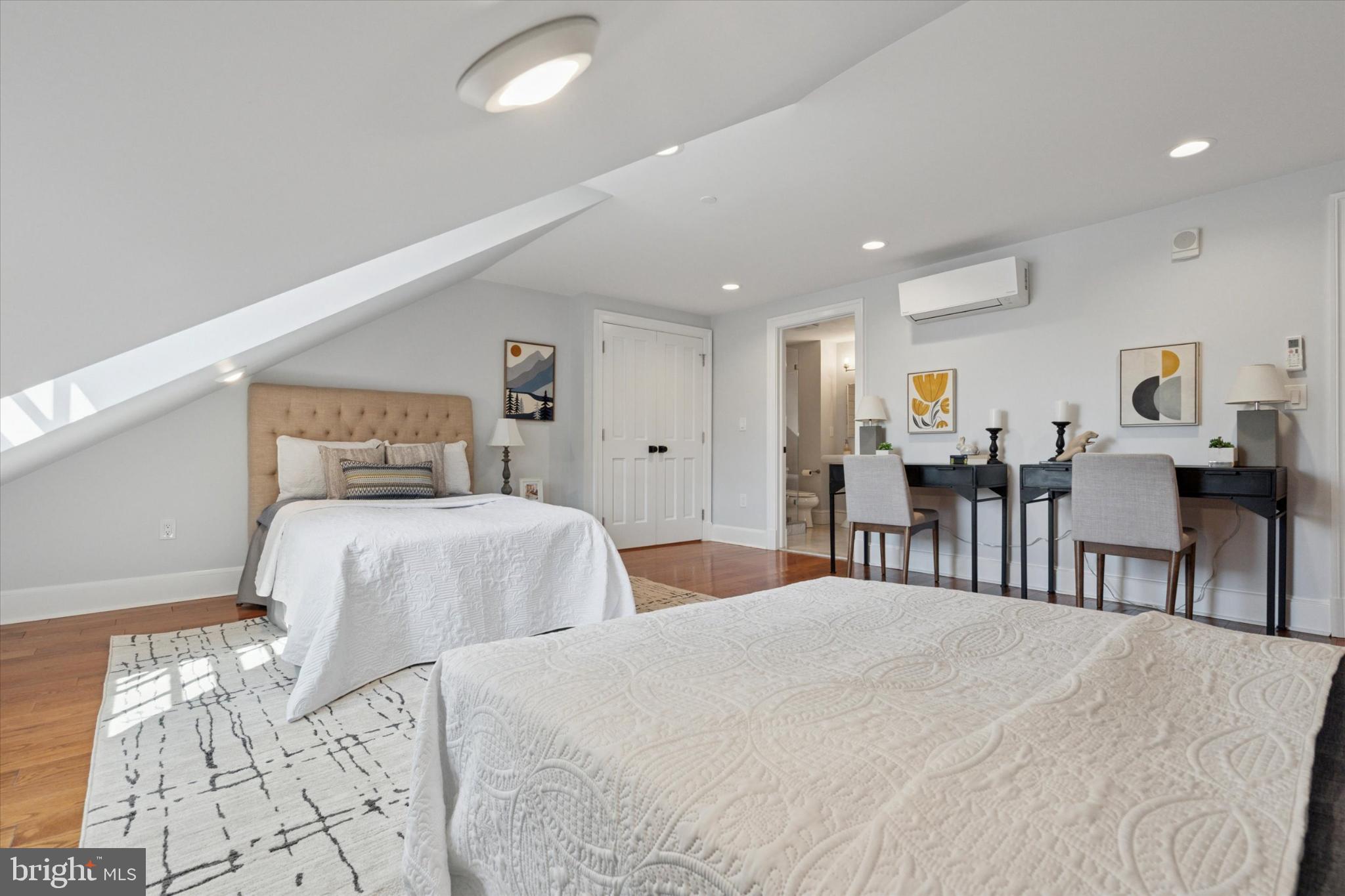 1215 Spruce Street, Unit 301 Philadelphia, PA 19107 - Photo 25 of 27 a bedroom with double bed and a large mirror