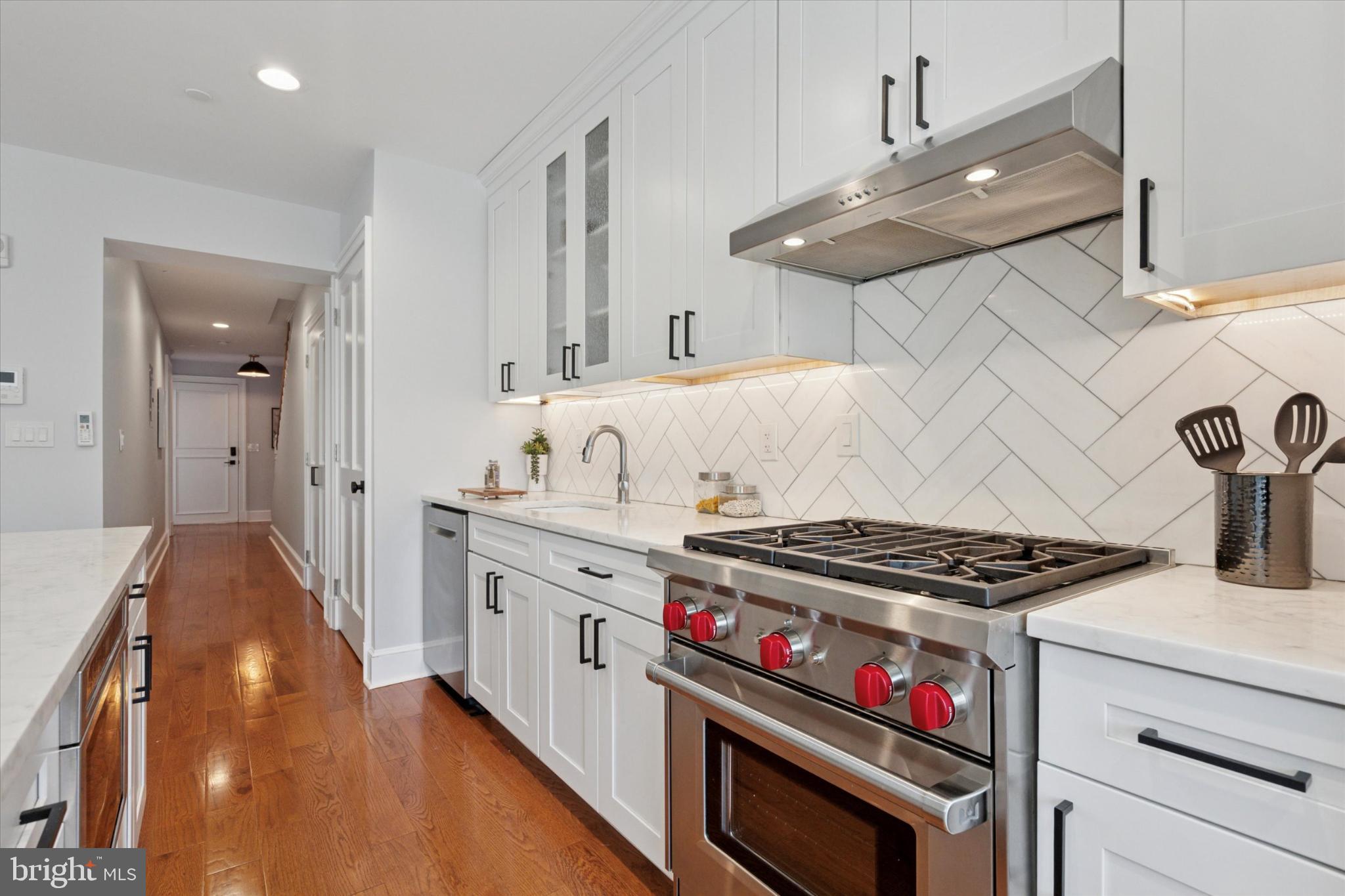 1215 Spruce Street, Unit 301 Philadelphia, PA 19107 - Photo 6 of 27 a kitchen with stove and cabinets