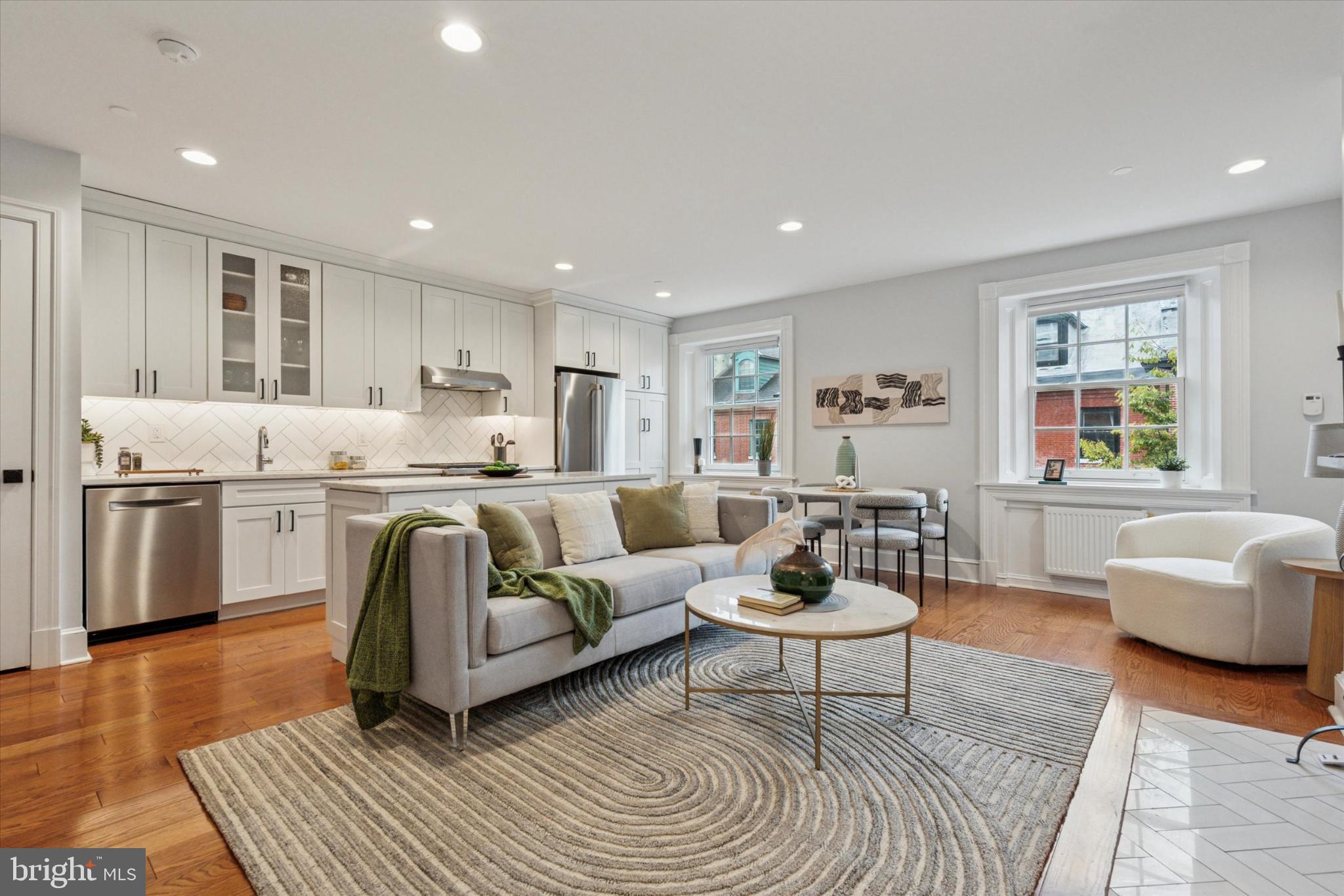 1215 Spruce Street, Unit 301 Philadelphia, PA 19107 - Photo 8 of 27 a living room with furniture and a wooden floor