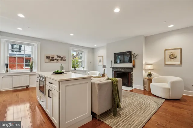 a kitchen that has a microwave a sink and a stove in it