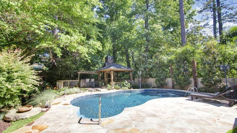 a view of a swimming pool with a patio