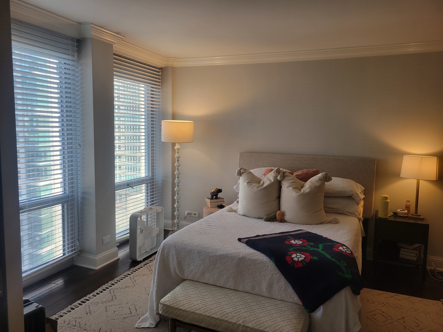 111 East Chestnut Street, Unit 20D Chicago, IL 60611 - Photo 6 of 8 a bedroom with a bed and wooden floor