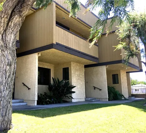 a view of a house with a small yard