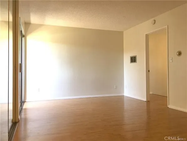 a view of hallway with wooden floor