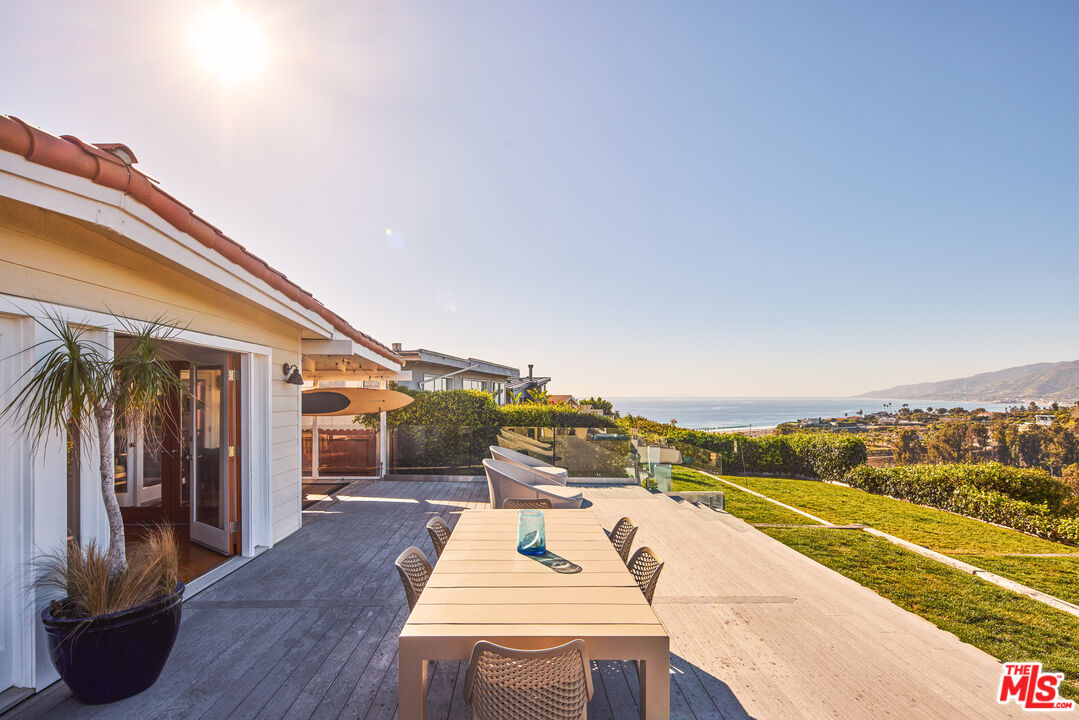 a view of a balcony with seating space
