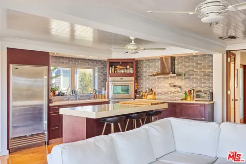 a bathroom with a sink a mirror and a shower