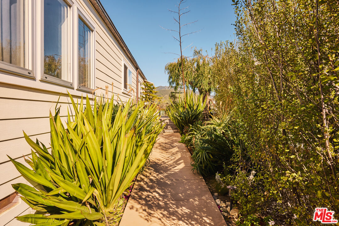 29500 Heathercliff Road, Unit 196 Malibu, CA 90265 - Photo 23 of 29 a view of a pathway along with potted plants