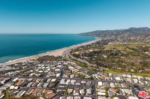a bathroom with a sink and a shower curtain