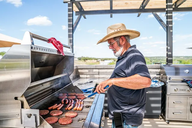 a view of a swimming pool with a lounge chair and floor to ceiling window