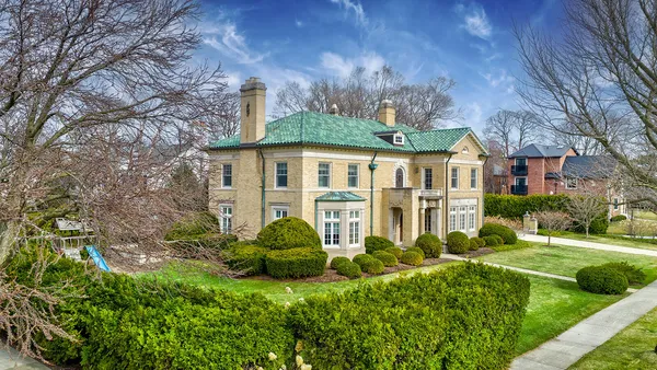a view of a house with a garden