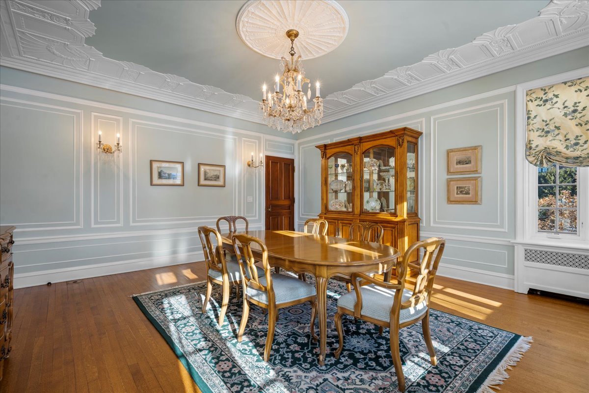 123 Oxford Road Kenilworth, IL 60043 - Photo 24 of 60 a view of a dining room with furniture window and wooden floor