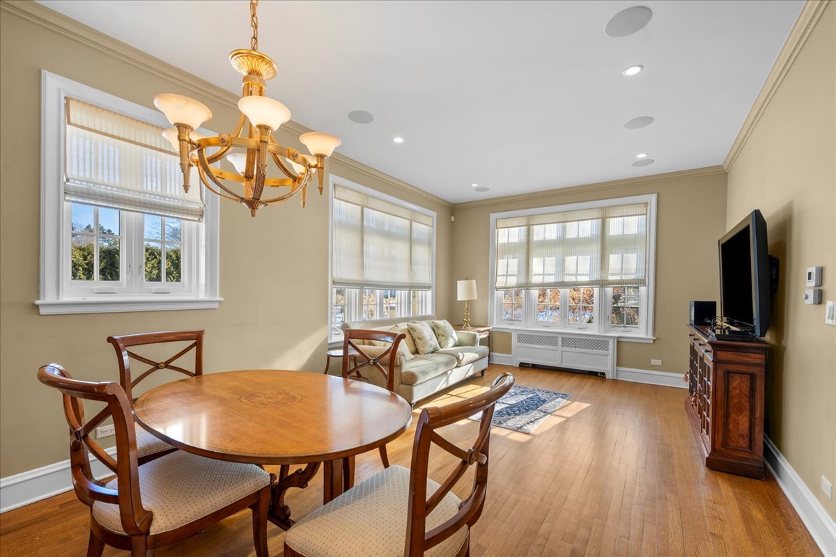123 Oxford Road Kenilworth, IL 60043 - Photo 28 of 60 a living room with furniture a flat screen tv and wooden floor