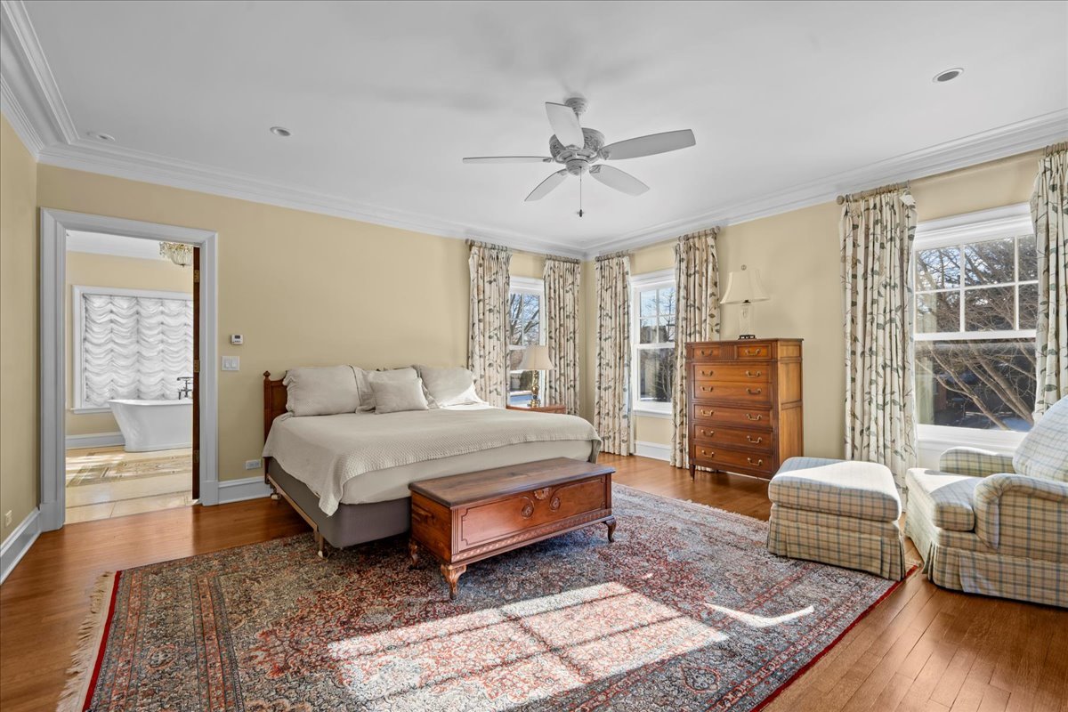 123 Oxford Road Kenilworth, IL 60043 - Photo 37 of 60 a spacious bedroom with a bed and wooden floor