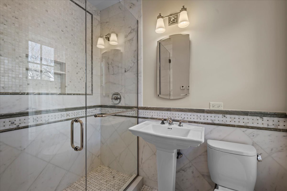123 Oxford Road Kenilworth, IL 60043 - Photo 46 of 60 a bathroom with a sink and mirror with bathtub
