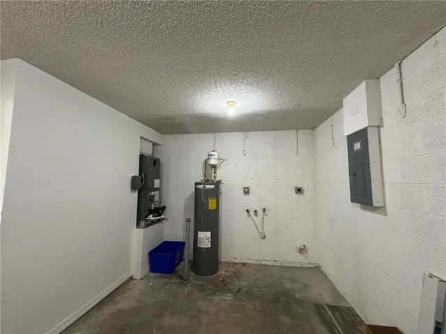 a view of a yard with wooden fence