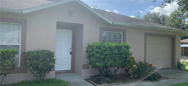 a potted plant in front of a house