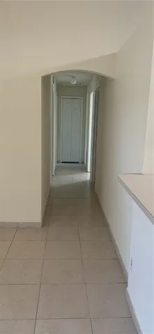 wooden floor in a hall with a bathroom