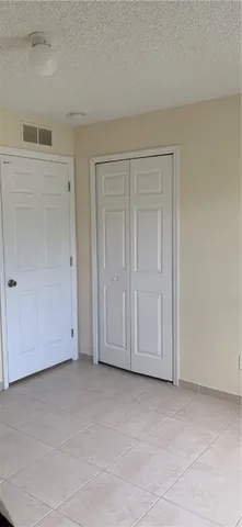an empty room with white door