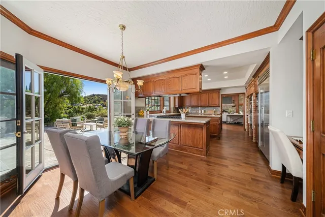 a dining room with furniture window and wooden floor