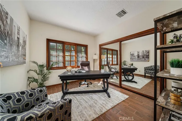 a living room with furniture large window and a table