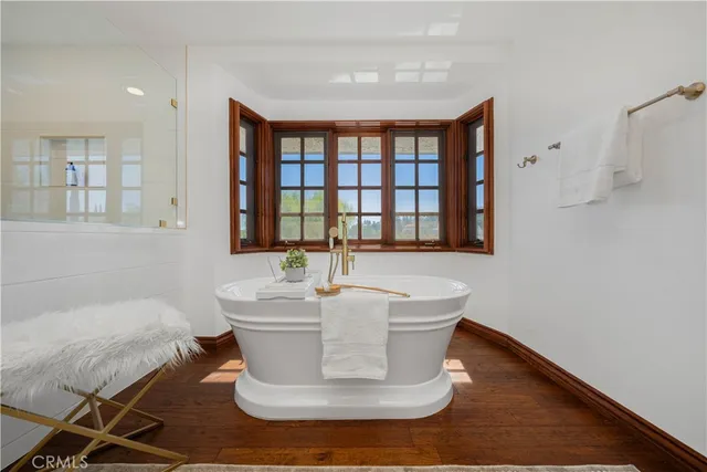 a living room with fireplace furniture and a window