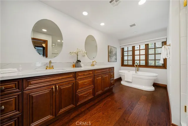 a bathroom with a tub and shower