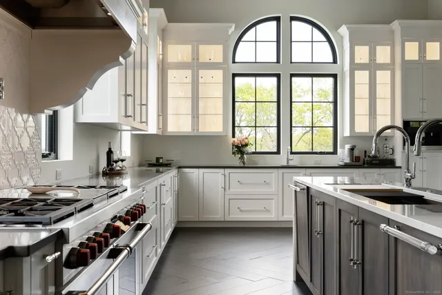 a living room with lots of furniture and a chandelier