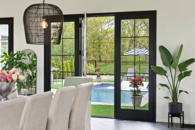 a view of a kitchen with a stove and a large window